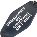 Hot Stamped Motel Keychain Something Ain't Right